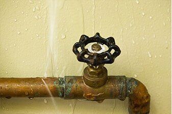 Water spraying from a corroded shutoff valve